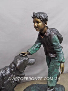 Homeward Bound outdoor garden bronze sculpture of young boy petting his dog