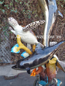 Ocean Harmony custom bronze artwork of leaping dolphin and calf sculpture