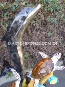 Ocean Harmony custom bronze artwork of leaping dolphin and calf sculpture