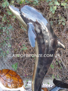 Ocean Harmony custom bronze artwork of leaping dolphin and calf sculpture