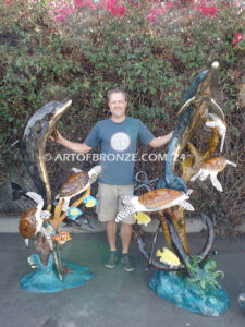 Ocean Harmony custom bronze artwork of leaping dolphin and calf sculpture