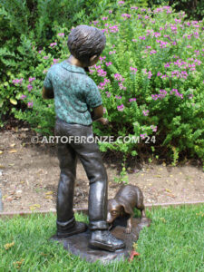 Play with me charming bronze statue of boy playing with puppy dogs