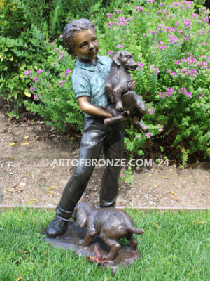 Play with me charming bronze statue of boy playing with puppy dogs