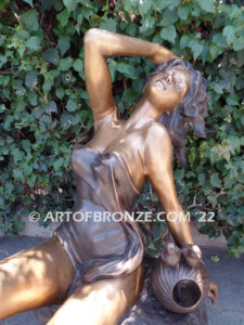 Relaxing Beauty outdoor alluring woman on rock bronze sculpture