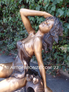 Relaxing Beauty outdoor alluring woman on rock bronze sculpture