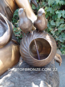 Relaxing Beauty outdoor alluring woman on rock bronze sculpture