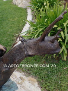 Snail Race outdoor bronze statue of young boy on snail