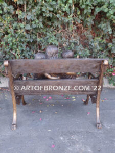 Special Touch bronze sculpture of three kids sitting on log with a injured baby bird in their hands