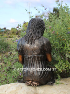 Tales and Dreams bronze statue of young girl reading her favorite novel