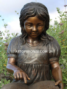 Tales and Dreams bronze statue of young girl reading her favorite novel