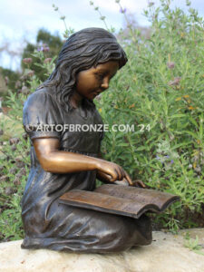 Tales and Dreams bronze statue of young girl reading her favorite novel