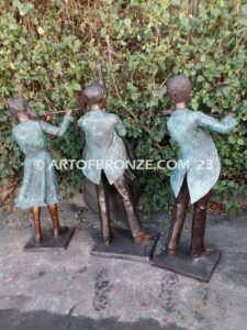 Virtuoso Pals wonderful outdoor bronze sculpture featuring three children playing music concert