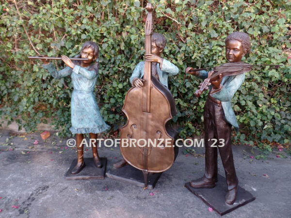 Virtuoso Pals wonderful outdoor bronze sculpture featuring three children playing music concert