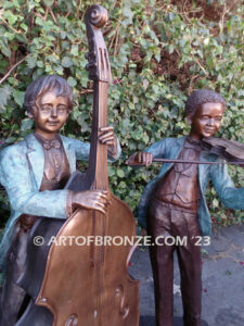 Virtuoso Pals wonderful outdoor bronze sculpture featuring three children playing music concert