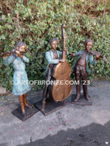 Virtuoso Pals wonderful outdoor bronze sculpture featuring three children playing music concert