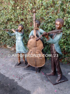 Virtuoso Pals wonderful outdoor bronze sculpture featuring three children playing music concert