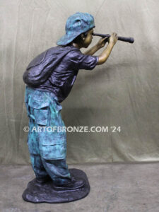 Voyage of Discovery bronze sculpture of young boy looking through telescope