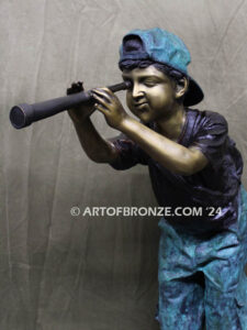 Voyage of Discovery bronze sculpture of young boy looking through telescope