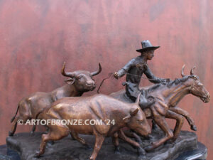 Cattle Herding bronze statue of rancher on horse steering his cattle