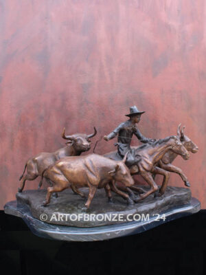 Cattle Herding bronze statue of rancher on horse steering his cattle