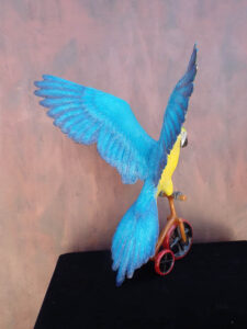 Easy Rider Blue and Gold Macaw riding tricycle bronze statue