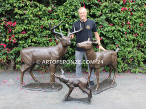 At First light outdoor monumental bronze buck, doe & fawn standing sculptures