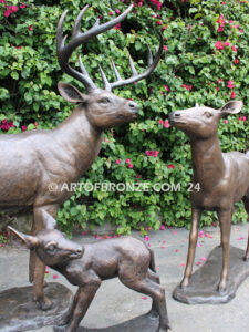 At First light outdoor monumental bronze buck, doe & fawn standing sculptures