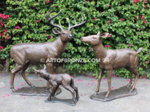 At First light outdoor monumental bronze buck, doe & fawn standing sculptures