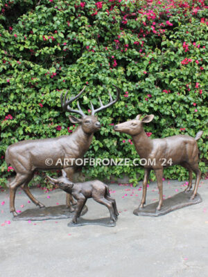 At First light outdoor monumental bronze buck, doe & fawn standing sculptures