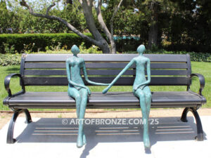 Bond of Us modern bronze sculpture of two sitting figures holding hands