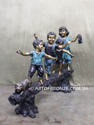 Log of Happiness bronze sculpture of four kids and dog playing on log