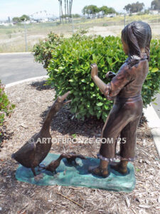 Protecting Mother bronze sculpture of young girl crossing path