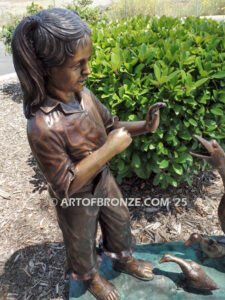 Protecting Mother bronze sculpture of young girl crossing path