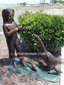 Protecting Mother bronze sculpture of young girl crossing path