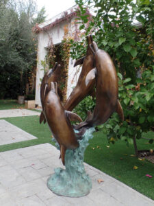 Rising Symphony fine art gallery bronze statue of four leaping dolphins in fountain