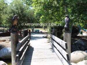 Watchtower right/left pair bronze sculptures of hawks resting on a branch