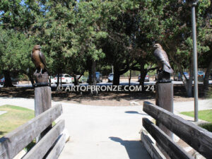 Watchtower right/left pair bronze sculptures of hawks resting on a branch