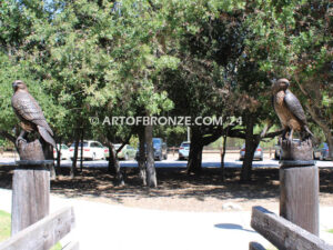 Watchtower right/left pair bronze sculptures of hawks resting on a branch