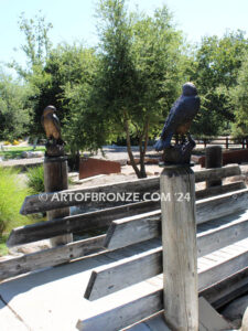 Watchtower right/left pair bronze sculptures of hawks resting on a branch