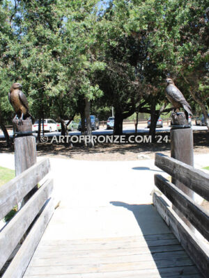 Watchtower right/left pair bronze sculptures of hawks resting on a branch