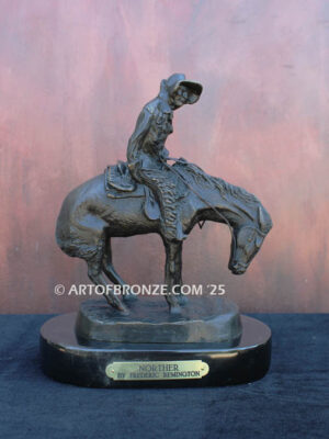 The Norther bronze statue after Frederic Remington featuring cowboy caught in forceful winds atop his horse